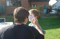 Ed painting Ross' face
